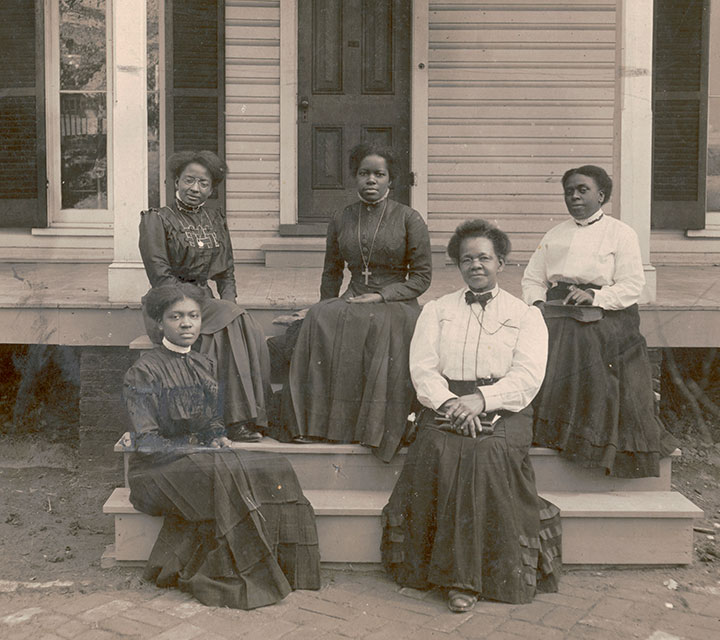Nannie Helen Burroughs (center) in front of the National Training School for Women and Girls, courtesy of Library of Congress