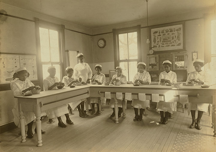 Students taking a cooking class at the National Training School for Women and Girls, courtesy of Library of Congress